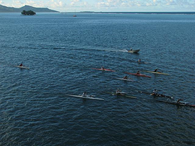 Canoes practicing (or racing?) beside the ship (taken from the veranda)