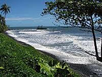 Beach on east side of Tahiti, with smooth black stones